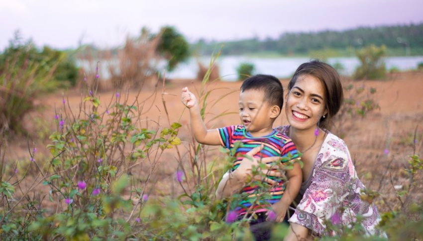 woman-hugging-boy-on-field-1660234